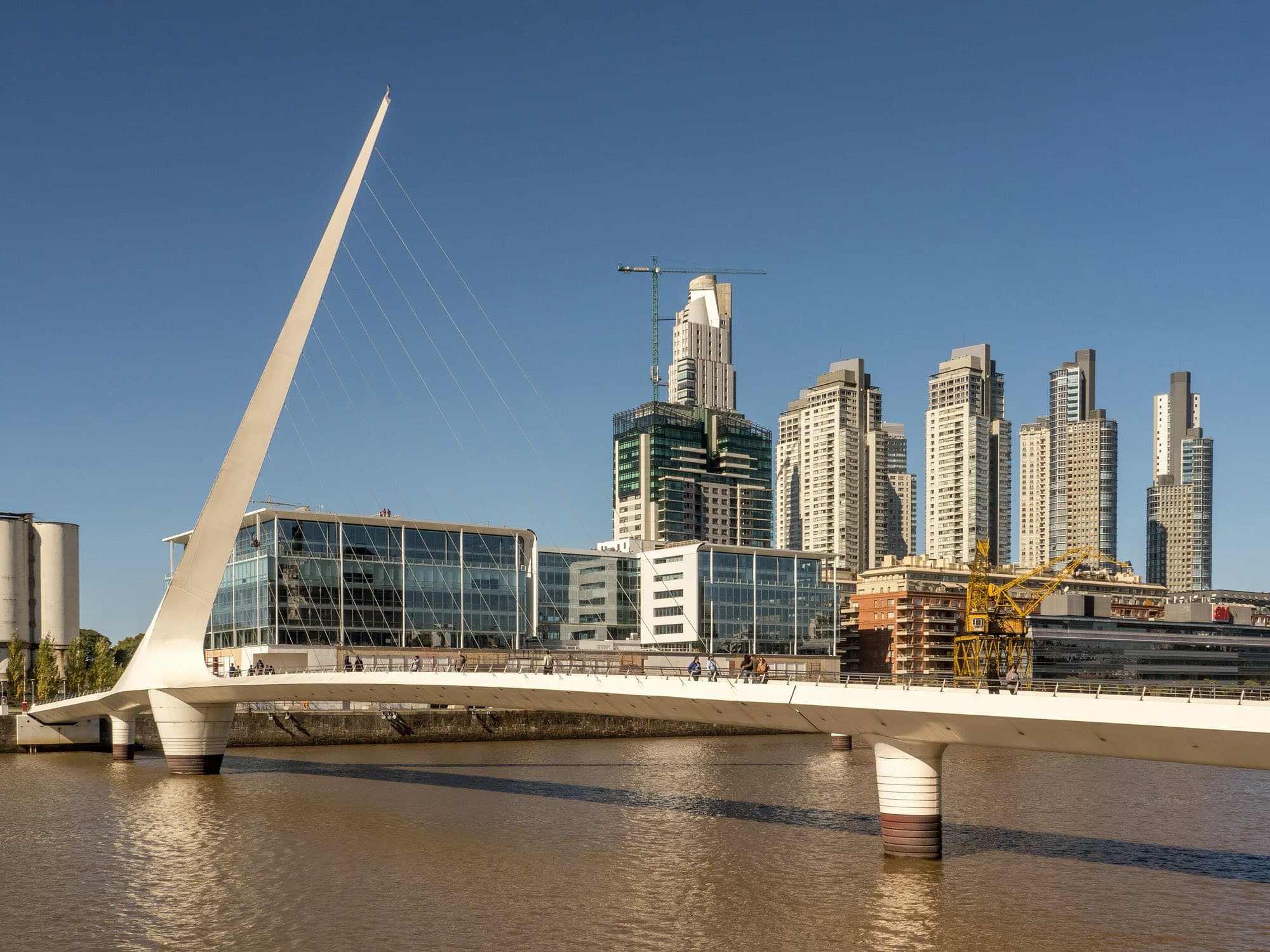 The white Puente de la Mujer footbridge in front of Puerto Madero's towers