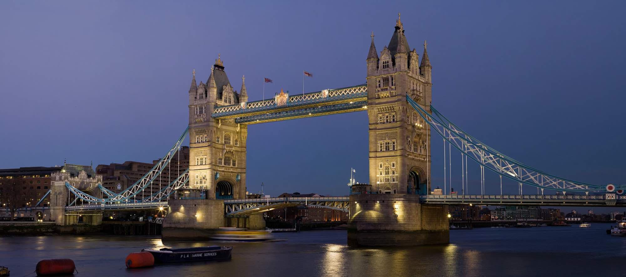 Tower Bridge lit up at dusk over the Thames