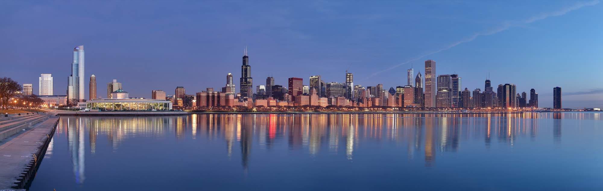 The Chicago skyline reflected in Lake Michigan at sunrise