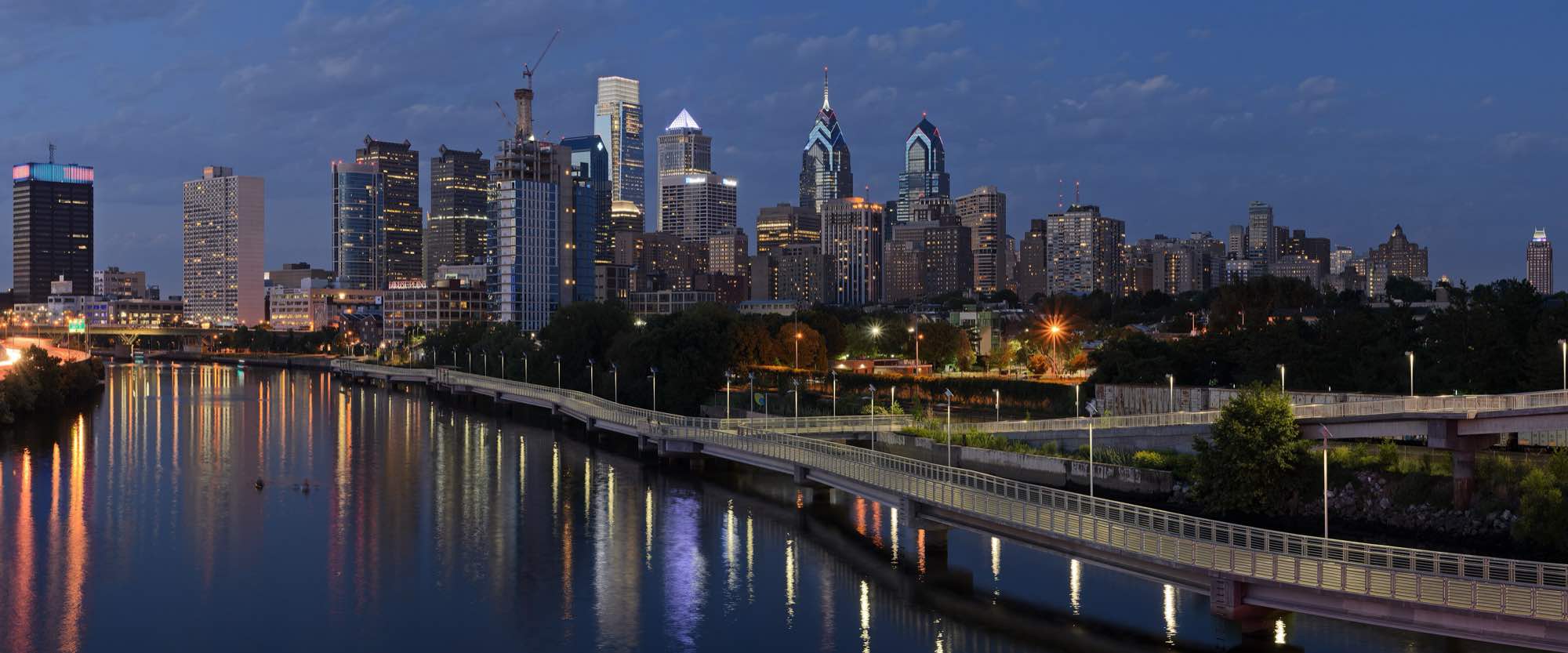 The Philadelphia skyline at dusk above the Schuylkill River
