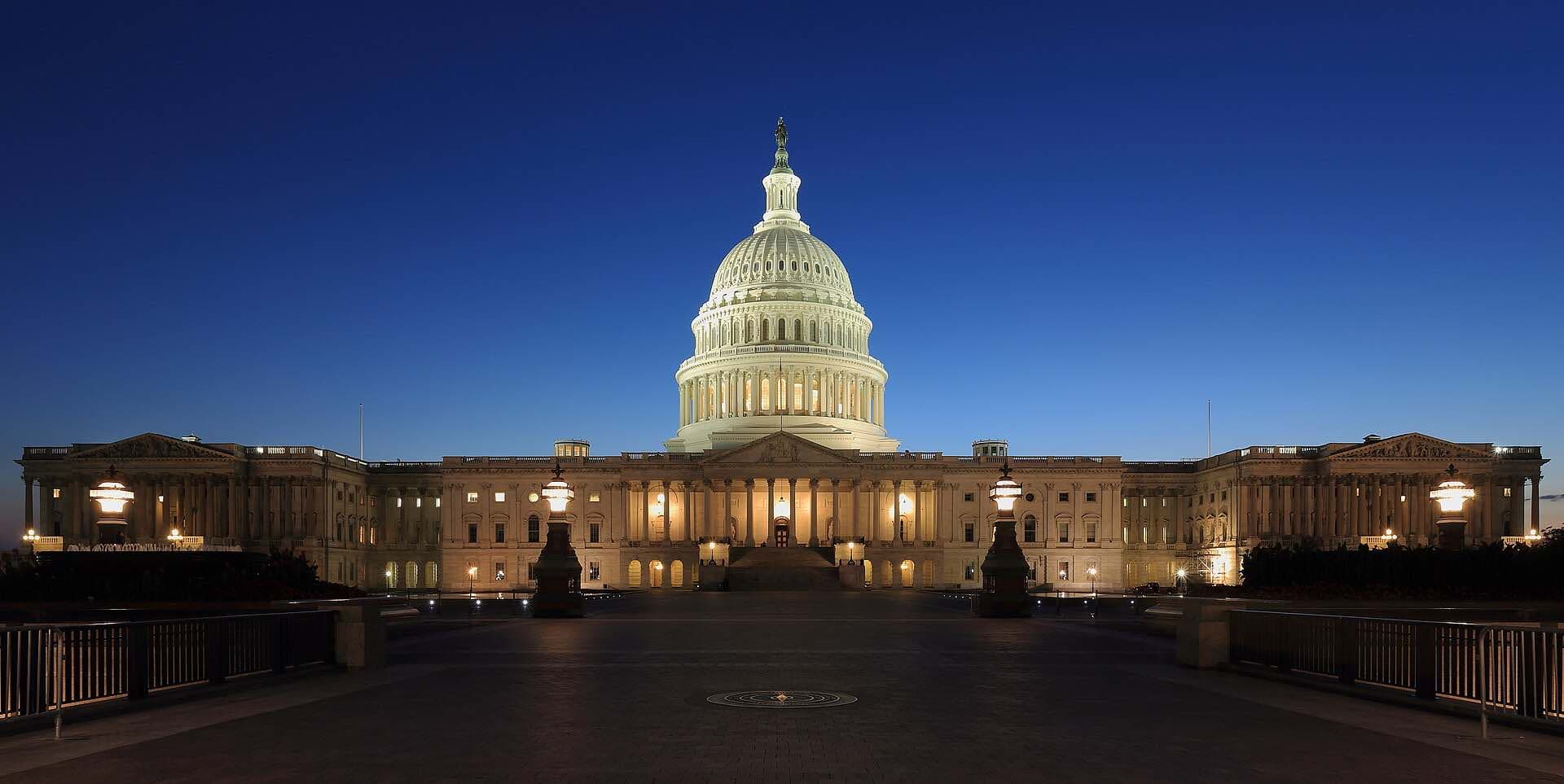 The United States Capitol lit up at dusk